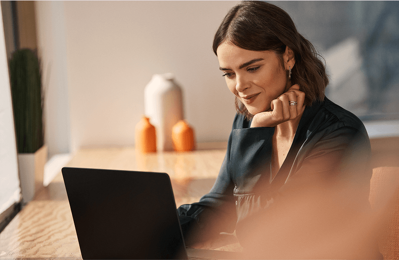 Woman looking at laptop