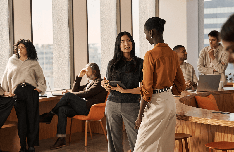 Multiple people talking in an office